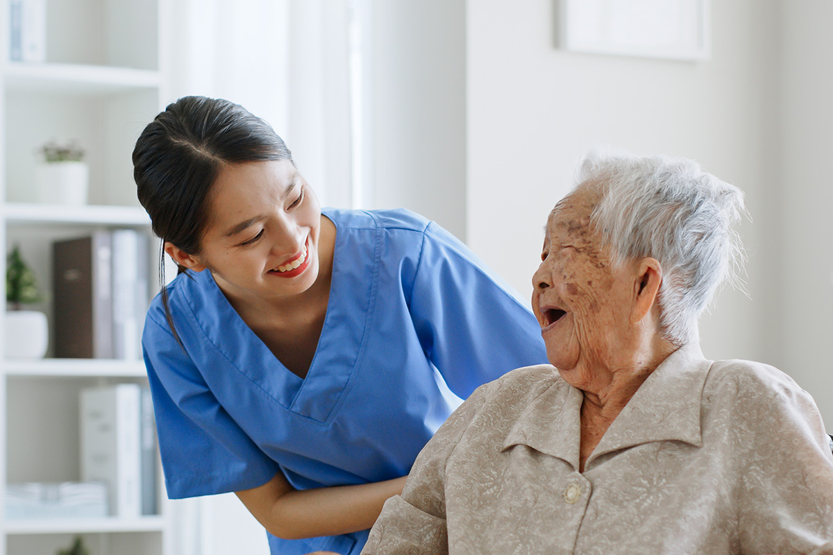 Certified Nursing Assistant works with a patient