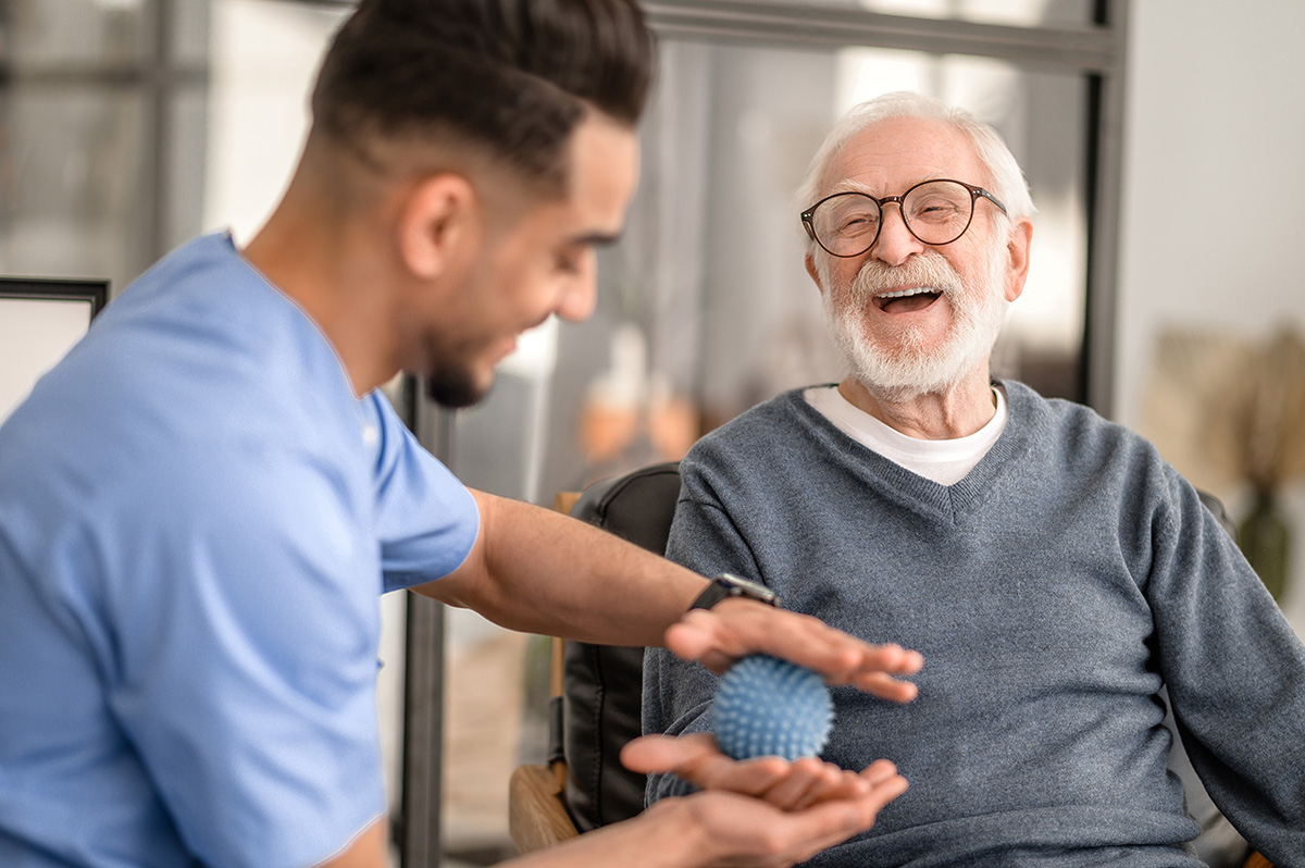 A Home Health Aide works with a patient